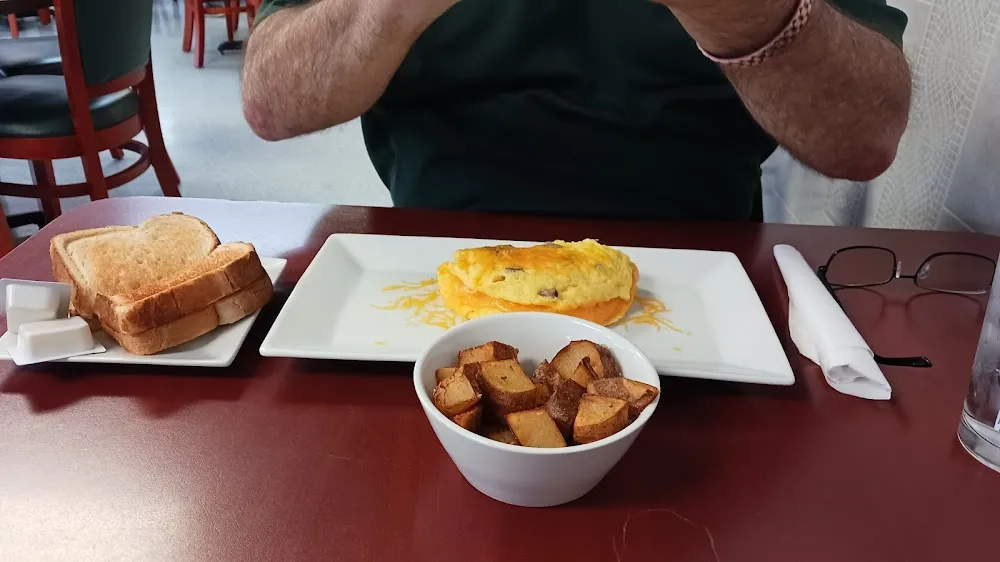 Country Sausage & Cheddar Cheese Omelet with a Side of Home Fries